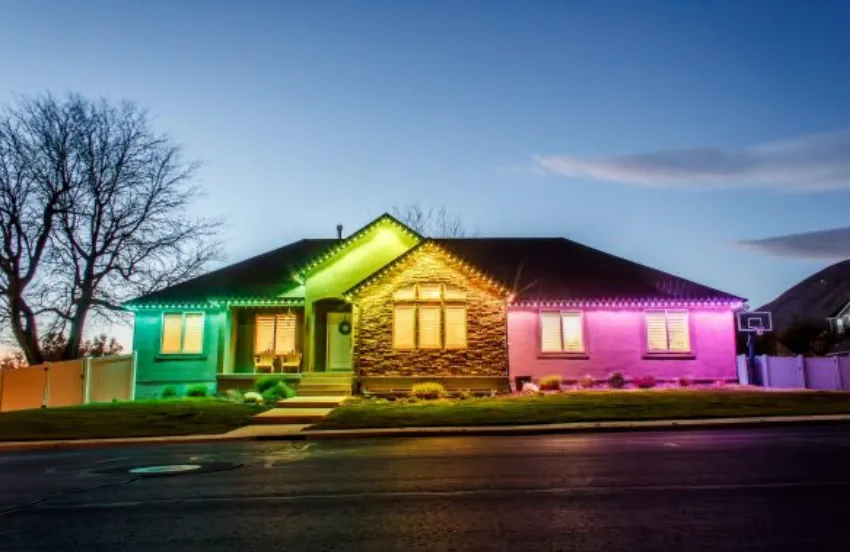 Home rooffline showing a permanent RGB lighting color demo — the same eaves shown in multiple colors by Bee Merry